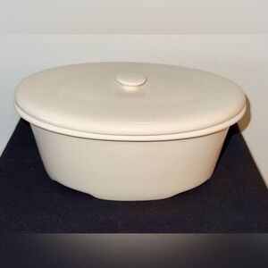Ceramic oval, baking dish with lid. Cream colored. 9”L x 6”W x 4”H